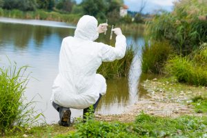 Scientist examing toxic water